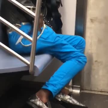 Man in leather jacket reaching in pocket