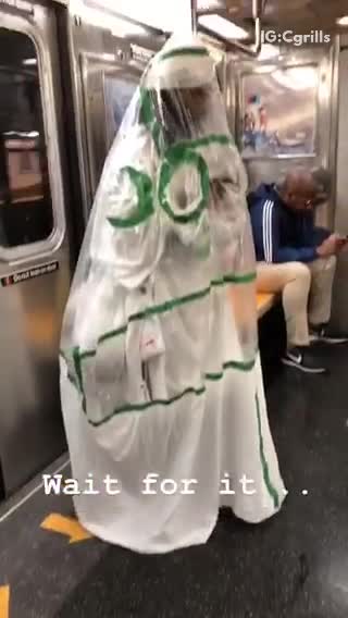 Man in green and white tarp