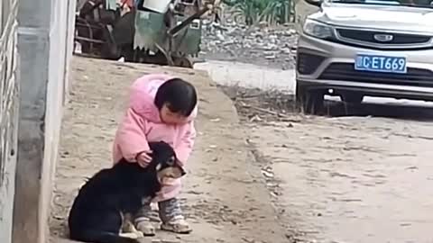 During the construction work , she covers the dog's ears, so that it isn't too loud for him