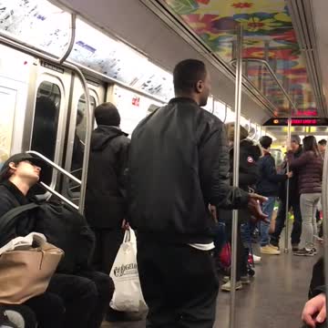 Man does hat flip trick on subway and misses