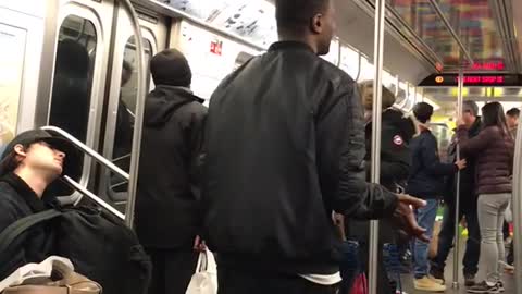 Man does hat flip trick on subway and misses