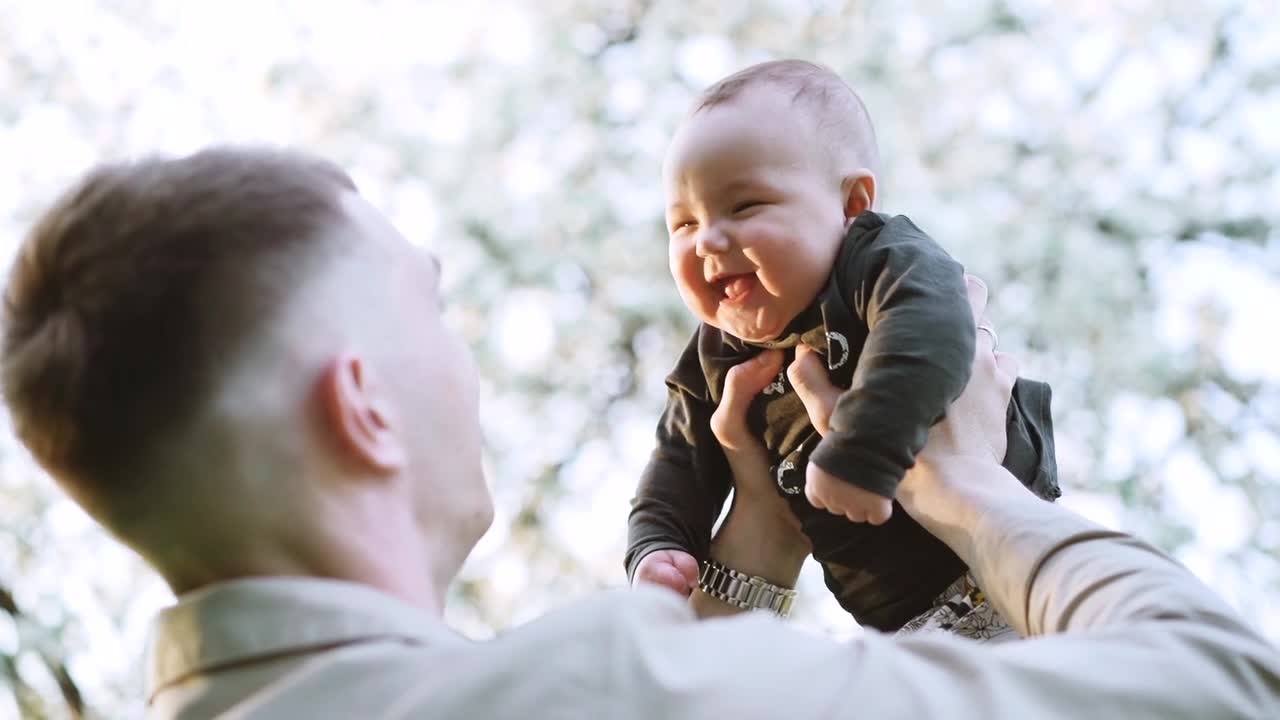 cute baby play with his father