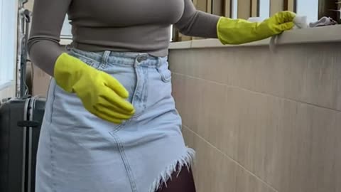 wash balcony in rubber gloves