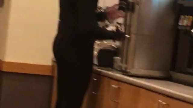 Guy in restaurant with full wetsuit