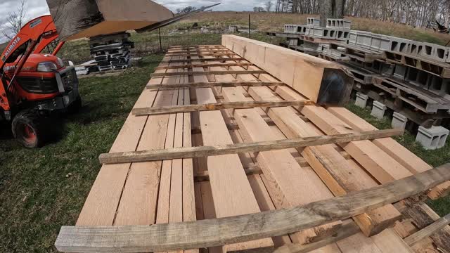 Stacking lumber 8x8 red oak beams compleates customers order