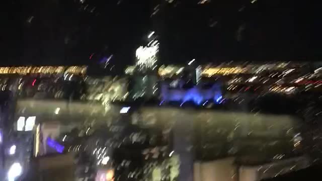 Overlooking the New York City Skyline at Night on a Manhattan rooftop