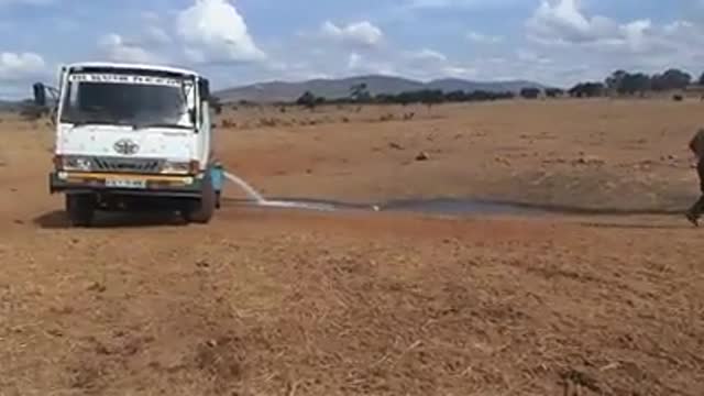 Man Brings Water To Wild Animals In Drought