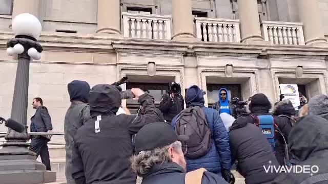 Minister Clayton Warichak praying at the Kenosha County Courthouse