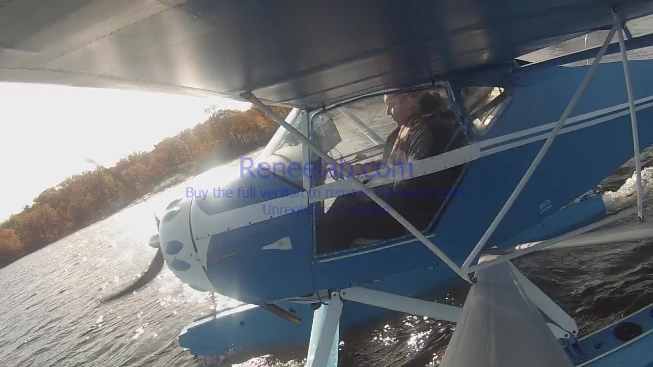 Kid landing the floatplane, strut cam view