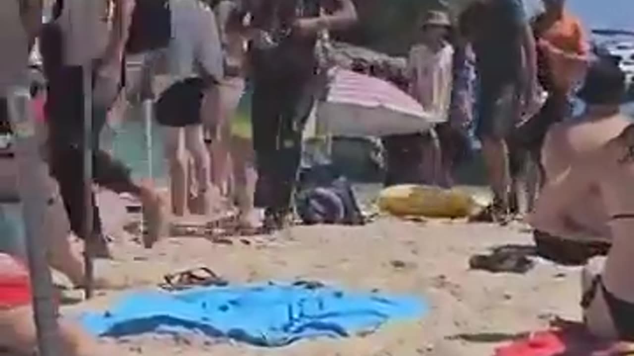 Young male immigrants arrived at the beach in Mallorca, Spain during the day.