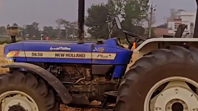 Farmer with New Holland Tractor