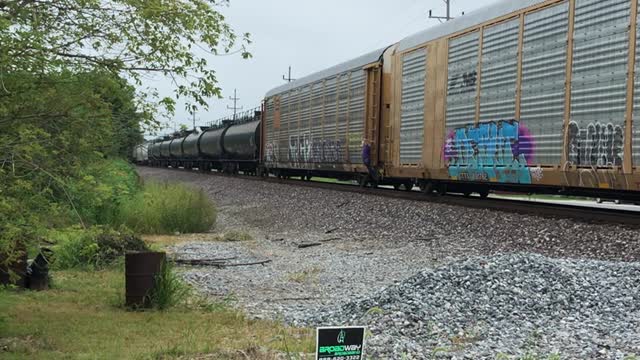 Disgruntled Lady Cranking Brakes on Parked Train