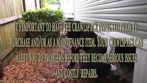 Inspecting the crawlspace of mobile home