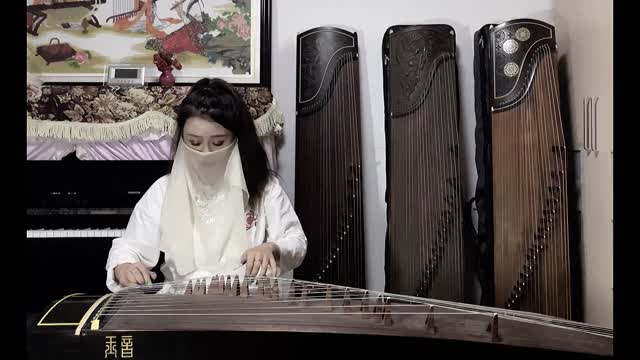 Beautiful girl's game on guzheng.