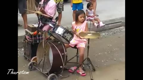 TWIN GIRL DRUMMER WITH THEIR BLIND FATHER PERFORMING IN THE STREET