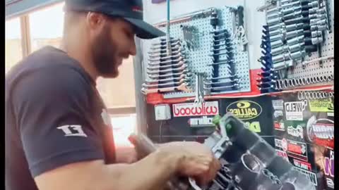 Routine maintenance of automobile by mechanic