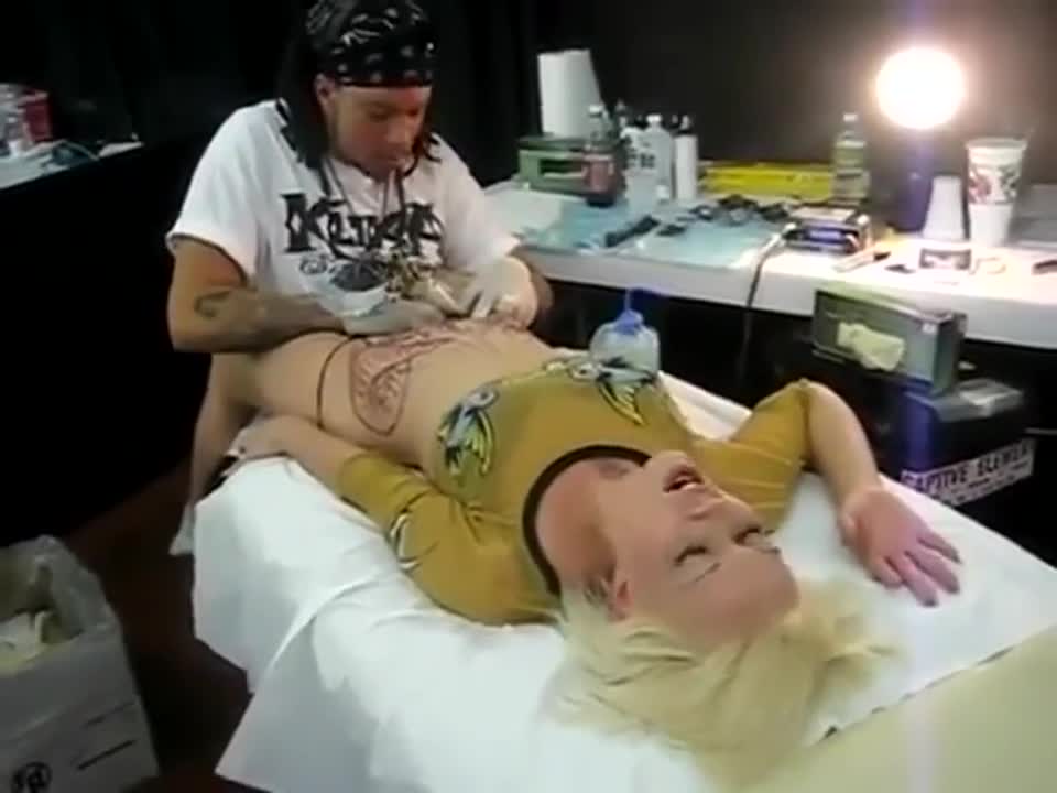 Crazy sexy girl doing tattoo on private part