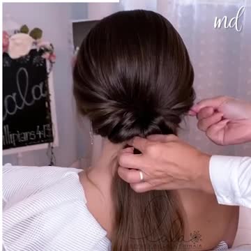 Here's one unique way of doing an elegant low bun!