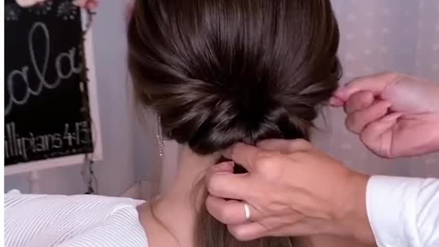 Here's one unique way of doing an elegant low bun!