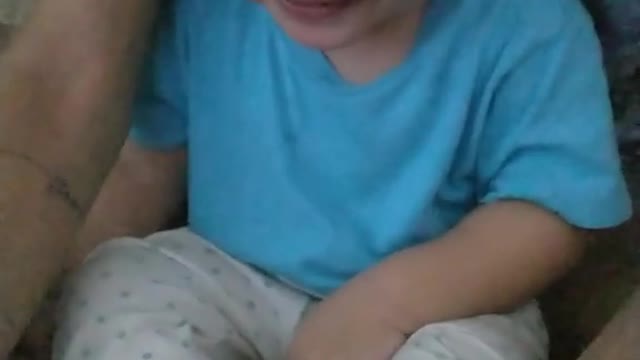 baby laughing watching drawing