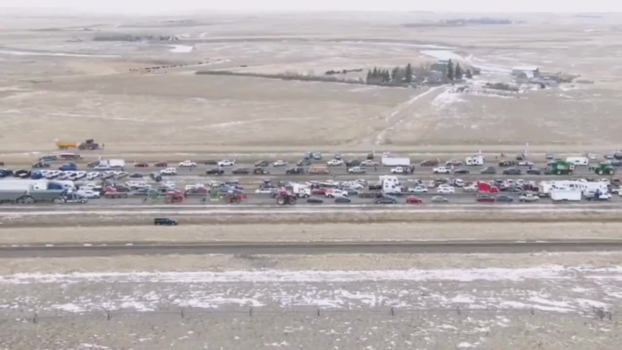 Aerial footage shows large number of truckers at the US-Canada border protesting vaccine mandate