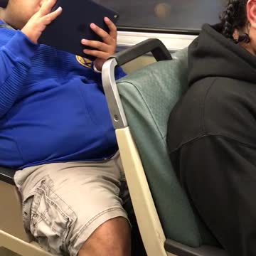 Man has phone mount on window