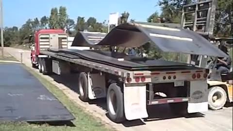 Unloading Steel Plate to build a 74 ft Sail Boat in my Front Yard