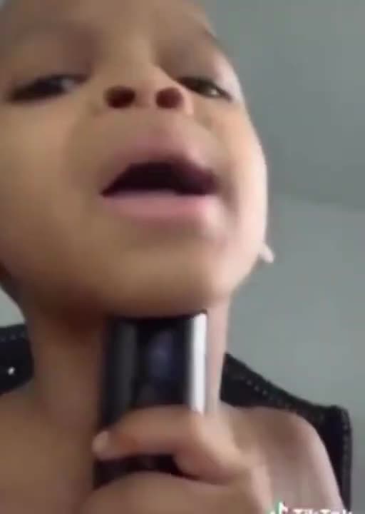 Kid uses his grandmas voice box for auto tune