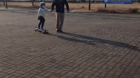 Cute baby riding skateboard 2