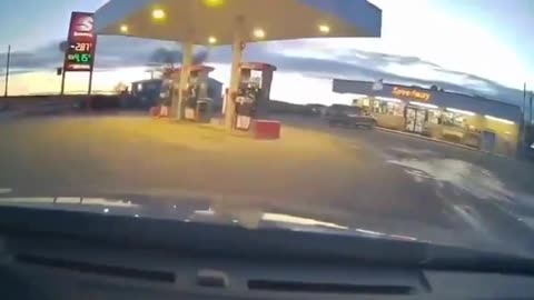 Truck plows through gas station