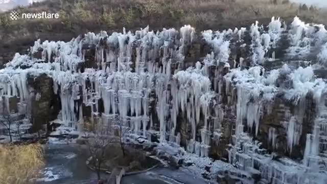 Waterfalls freeze into incredible winter wonderland in eastern China