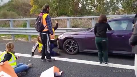 Man not having the climate protesters blocking the road!