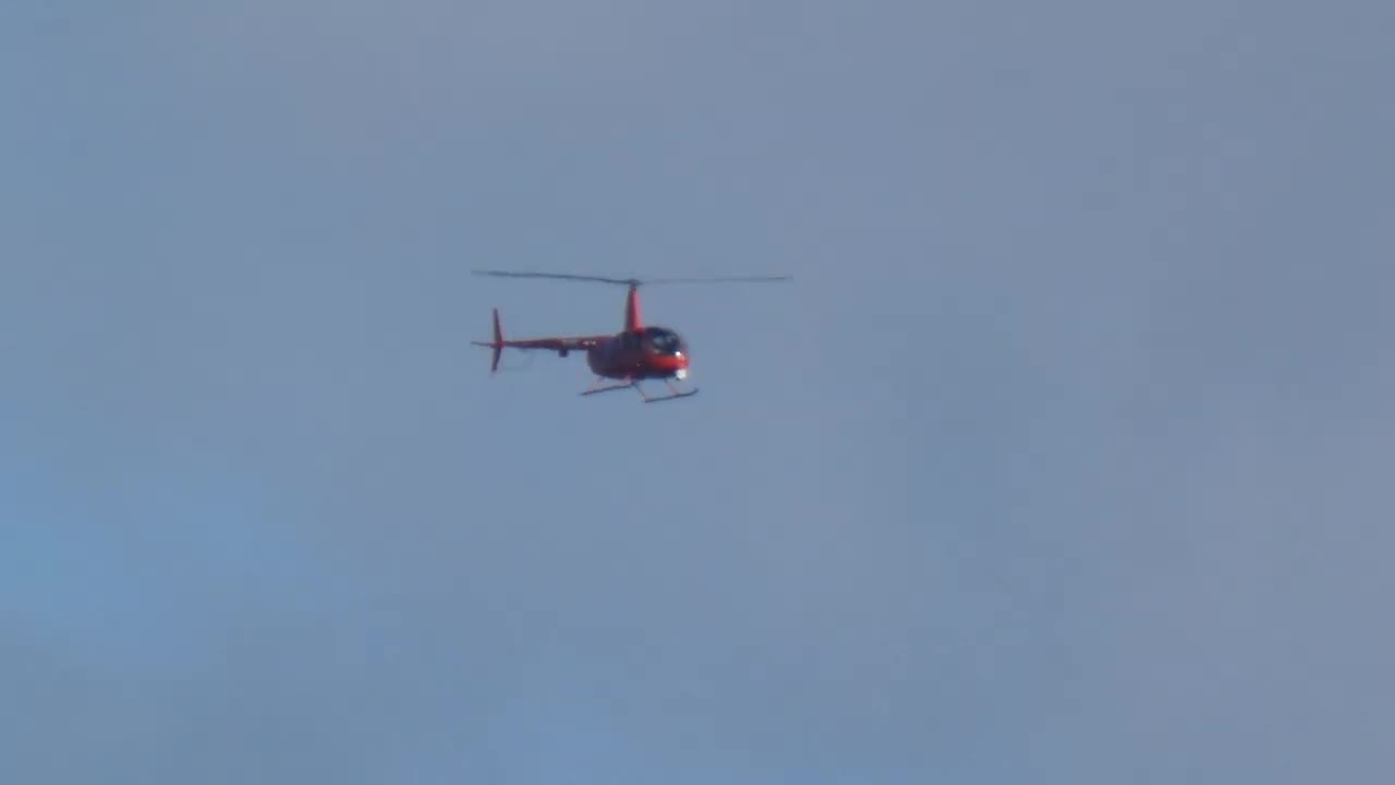 Police chopper with nose Dome camera during protest in Preston