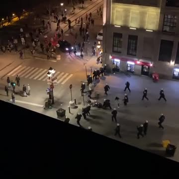 Video Shows A Woman Being Pushed To The Ground By SWAT At Last Week's Anti-Curfew Protest