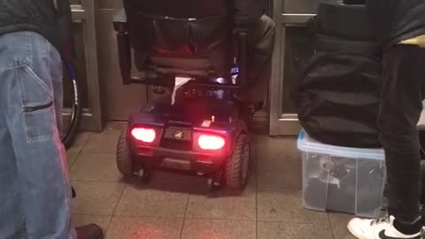 Guy in wheel chair refuses to wait for next elevator