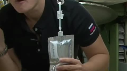 Astronaut drinking water at International Space Station