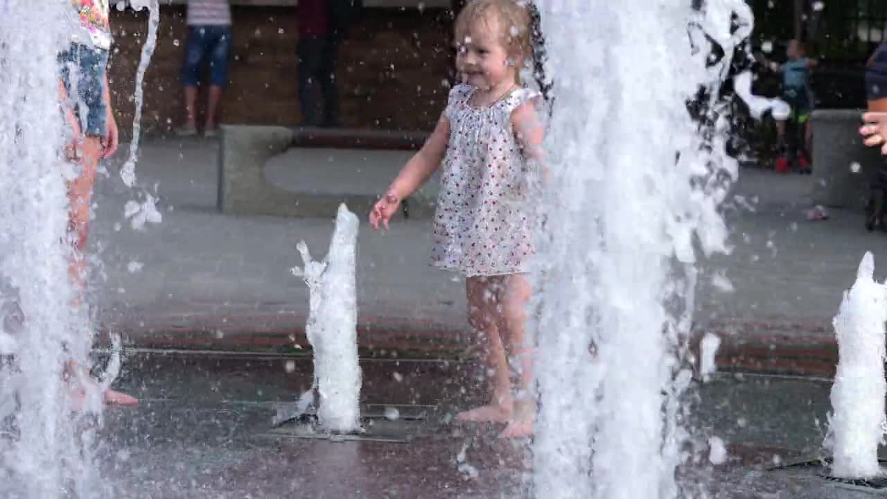 Children having Fun in a Ester fountain