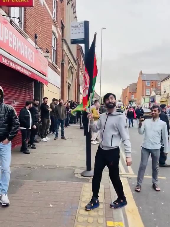 Feral invader hordes imported by jews dominate jewK streets with their foreign flags