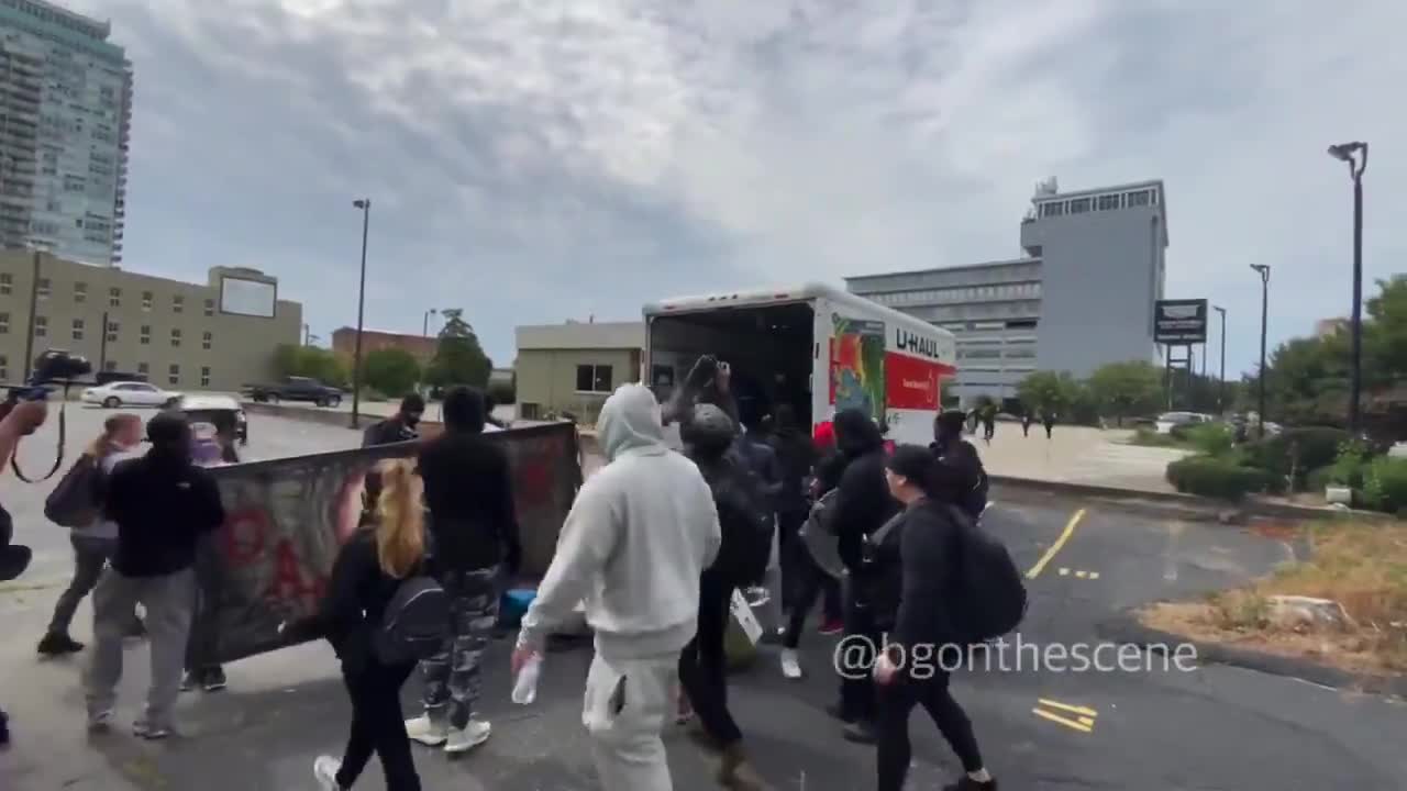 Rioters unloading shields, signs, and other "Supplies" - Louisville, Ky