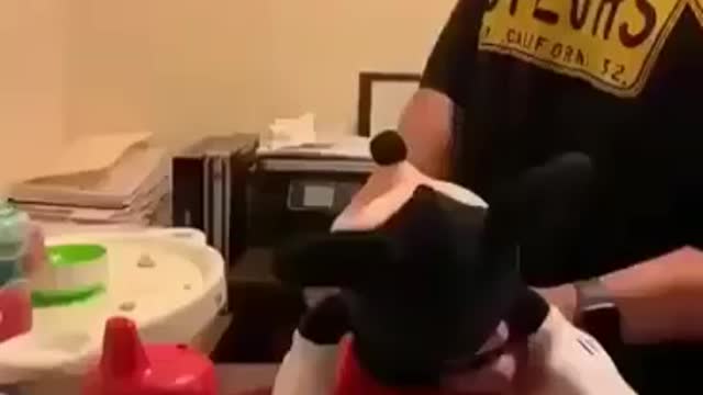 Baby doesnt want food, Mickey Mouse toy gets it.