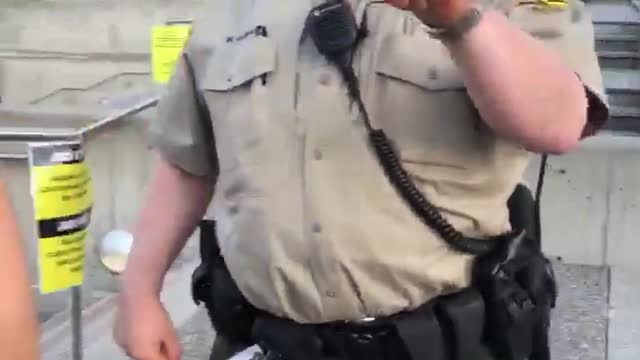 Protester Detained After Dangling a Donut on a Stick