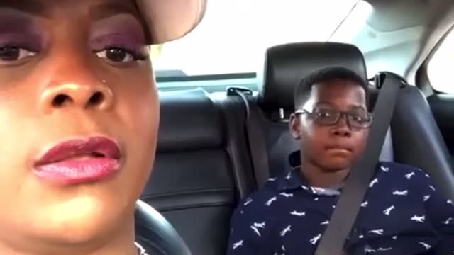 Kid flips mom off!