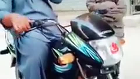 Funny indian man on bike