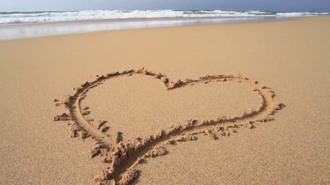 The heart in the sand is so romantic