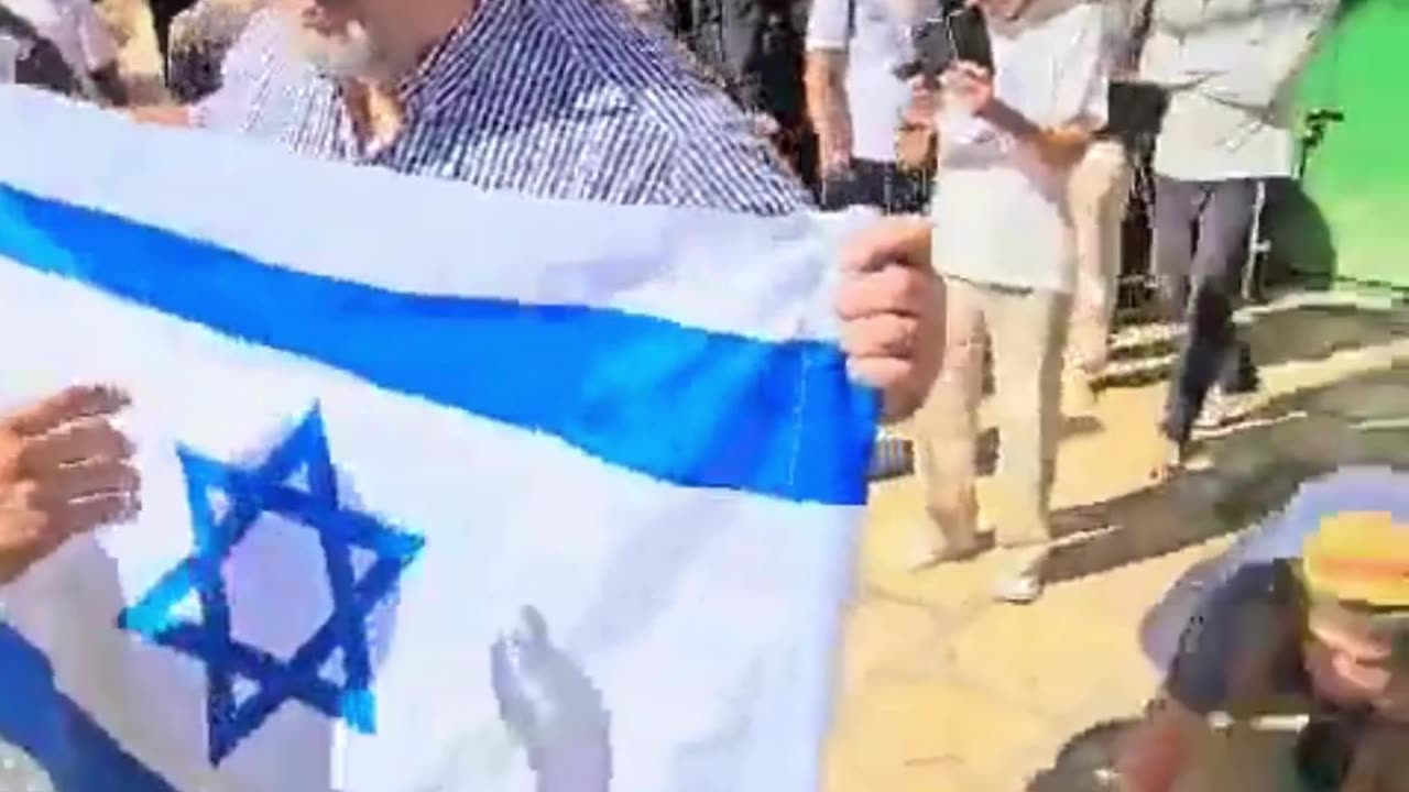 A group of Jewish worshipers singing Israel's national anthem 'HaTikva' on