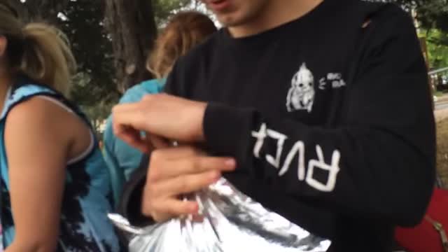 kid drink wine from sack