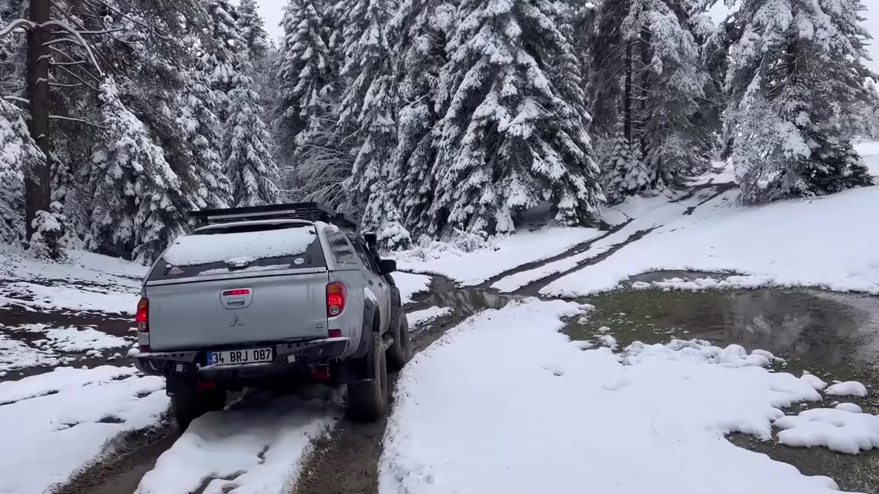 Family camping in snowy forest