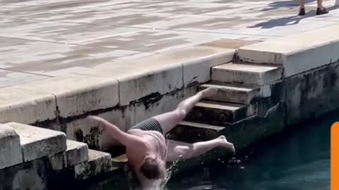 "Epic Dive... Not! Man's Hilarious Slip-Up Turned Fake Dive"