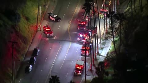 Three LA police officers shot, suspect barricaded