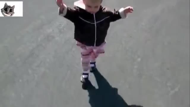 girl plays with shadow for the first time and falls cutely